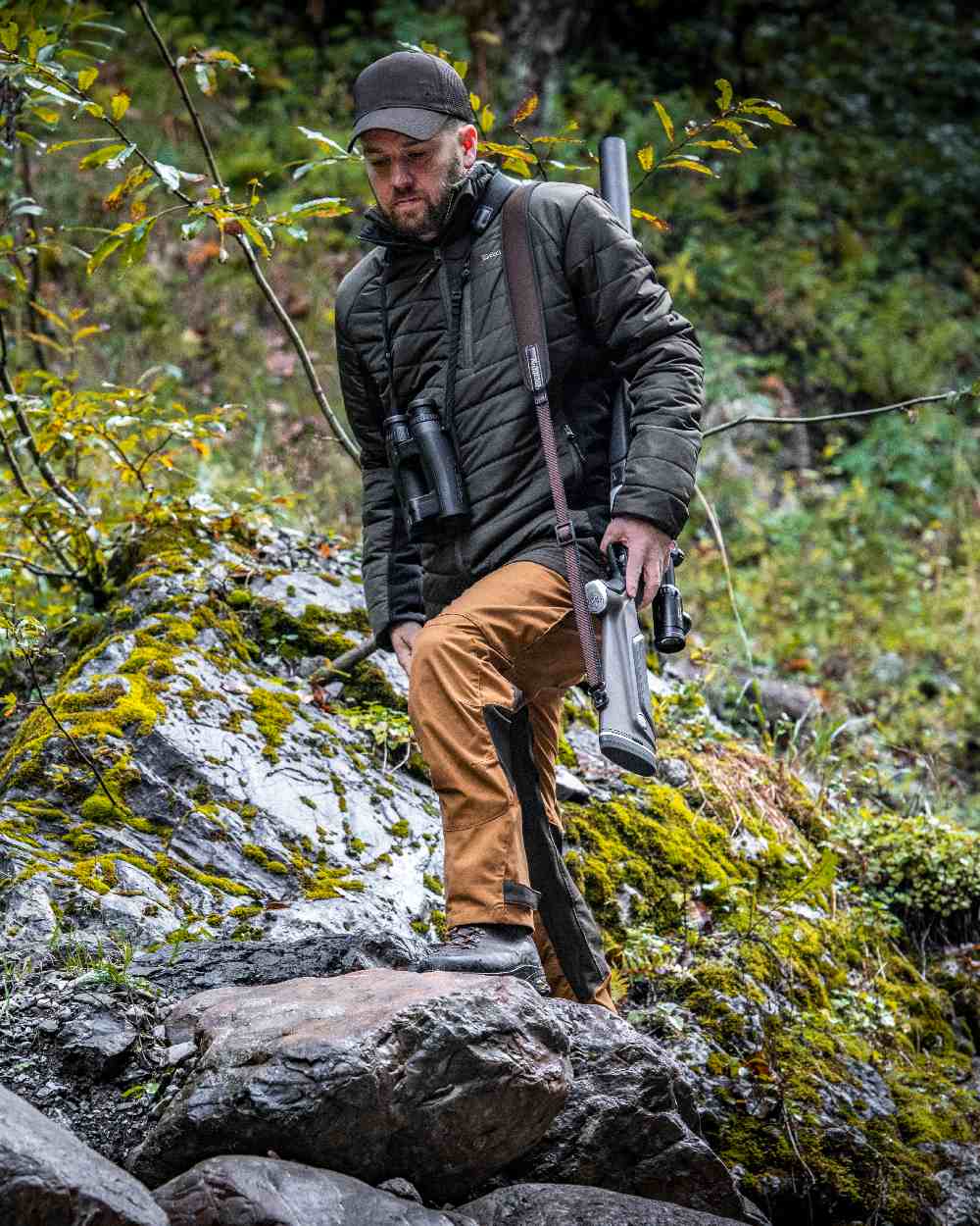 Adventure Green coloured Deerhunter Moor Padded Softshell Jacket on forest background