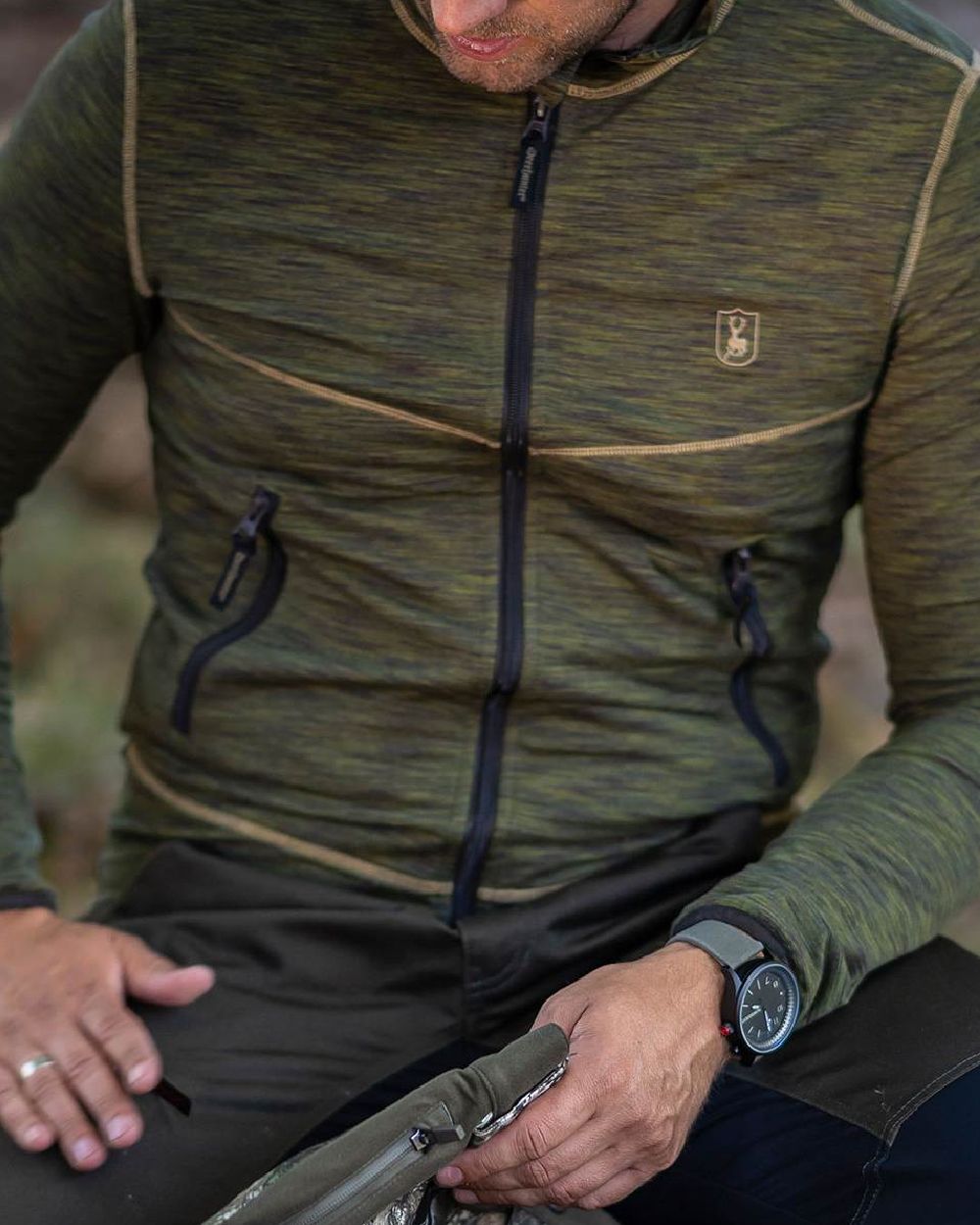 Green Melange coloured Deerhunter Norden Fleece Jacket on forest background