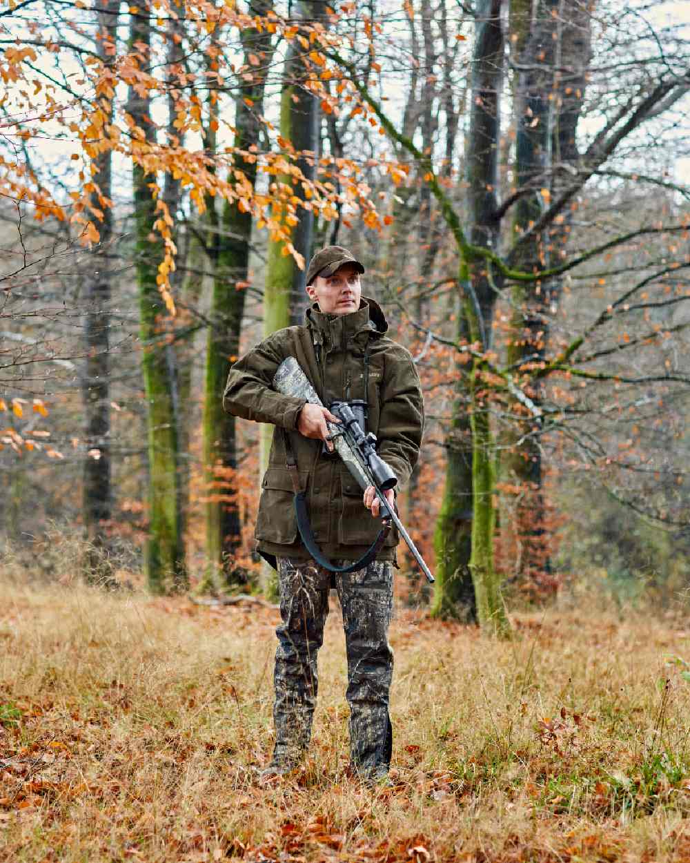 Peat Coloured Deerhunter PRO Gamekeeper Jacket on forest background