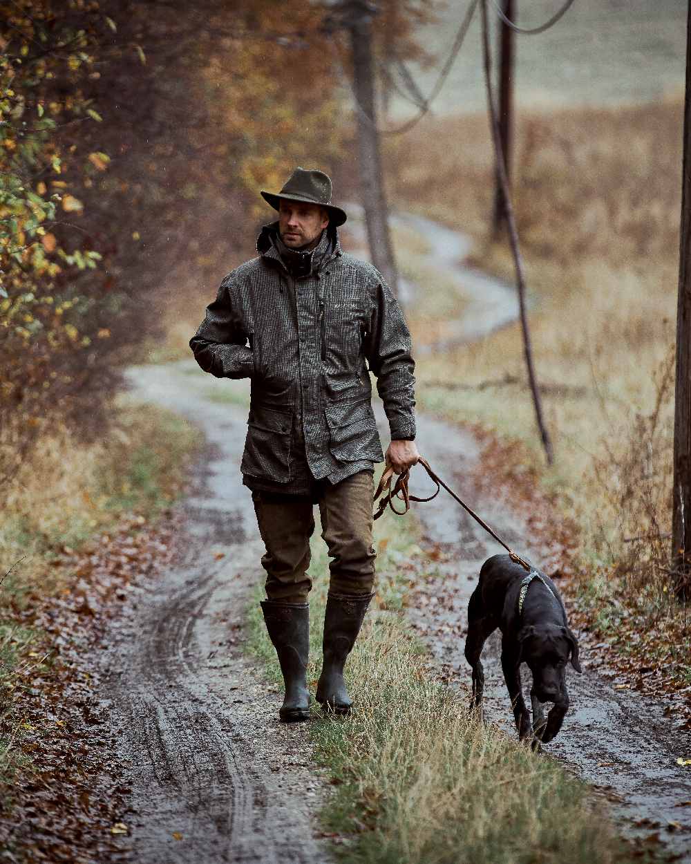 Turf Coloured Deerhunter PRO Gamekeeper Jacket on forest background