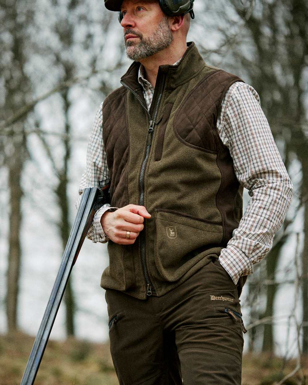 Peat Coloured Deerhunter Pro Gamekeeper Boot Trousers on blurry background