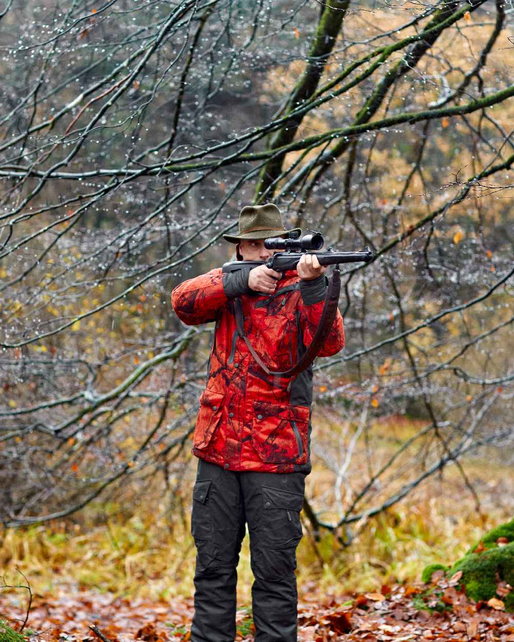 Realtree Edge Red coloured Deerhunter Ram Arctic Jacket on forest background