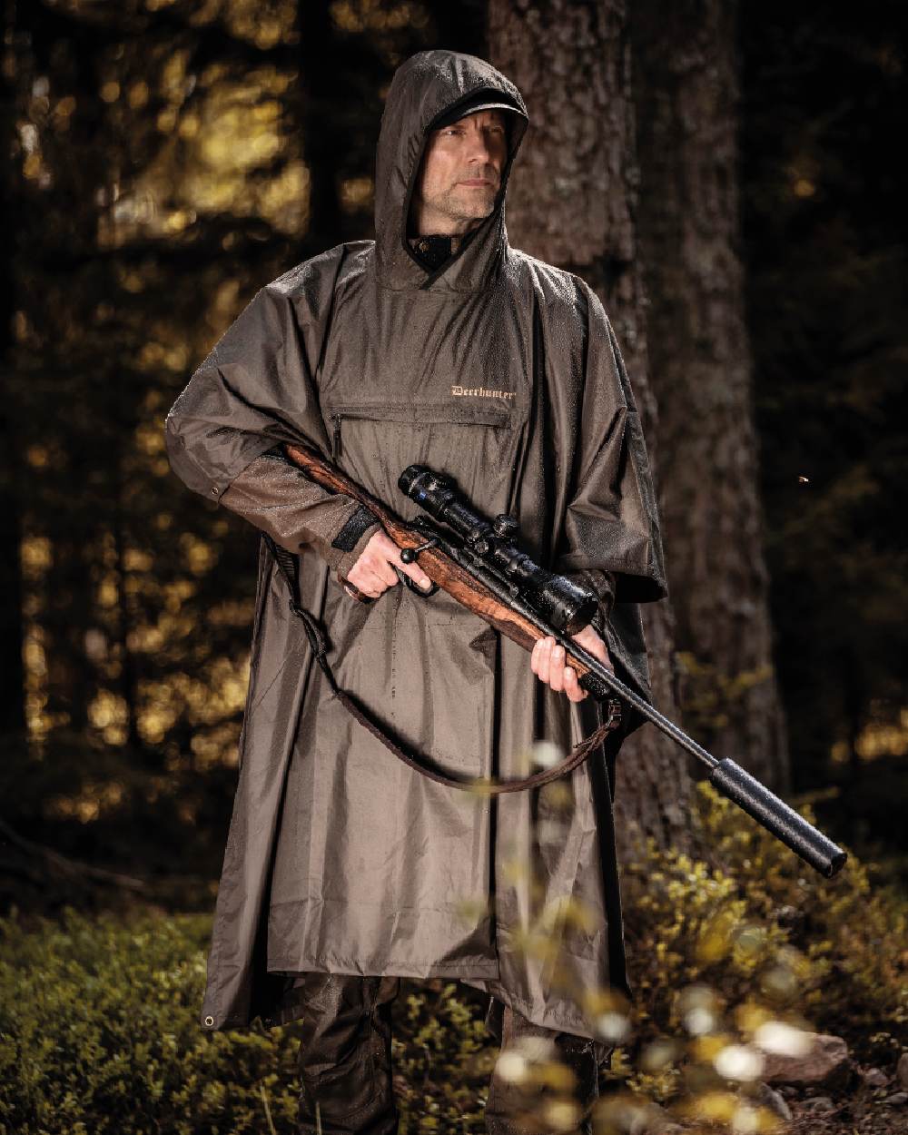Timber coloured Deerhunter Survivor Rain Poncho on forest background