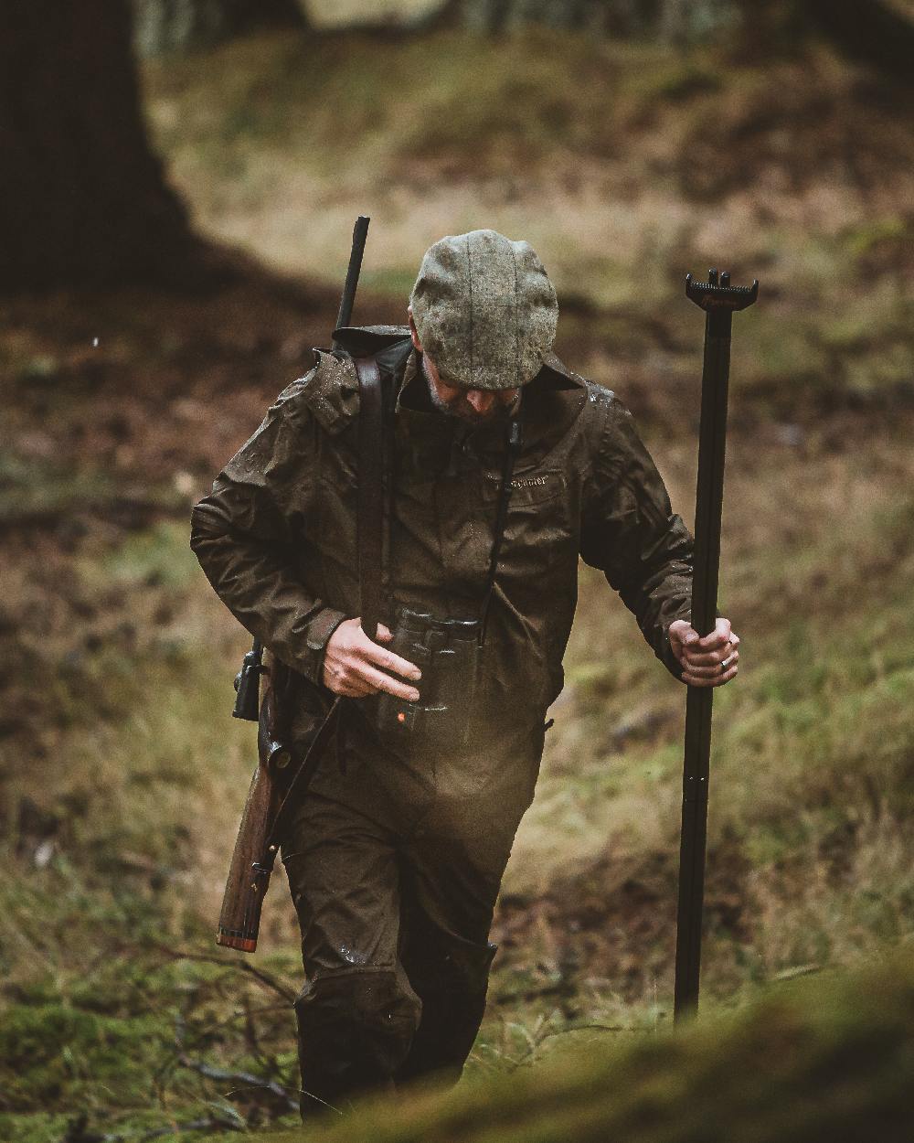 Canteen coloured Deerhunter Track Rain Trousers on forest background