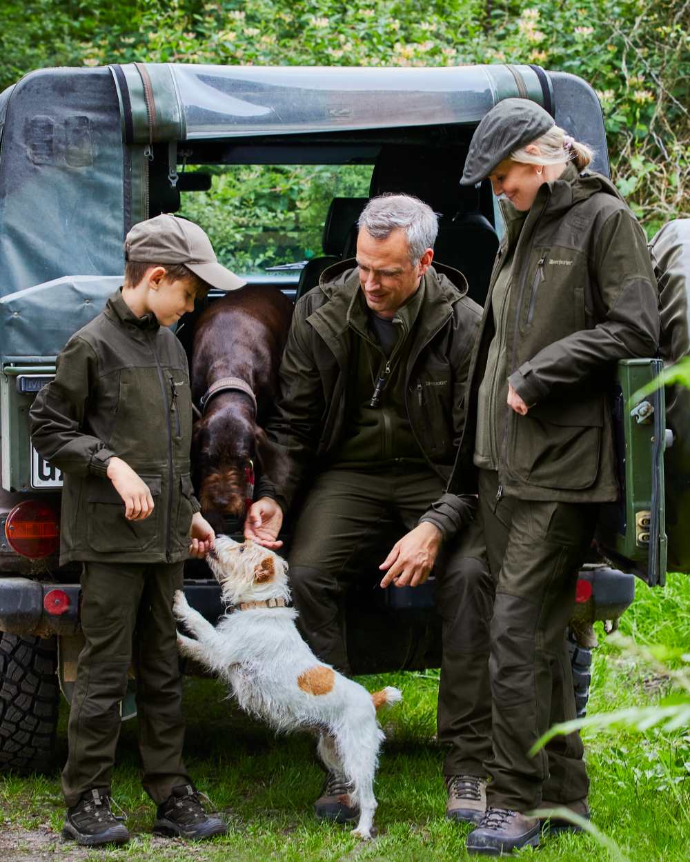 Olive Night Melange coloured Deerhunter Youth Chasse Trousers on forest background