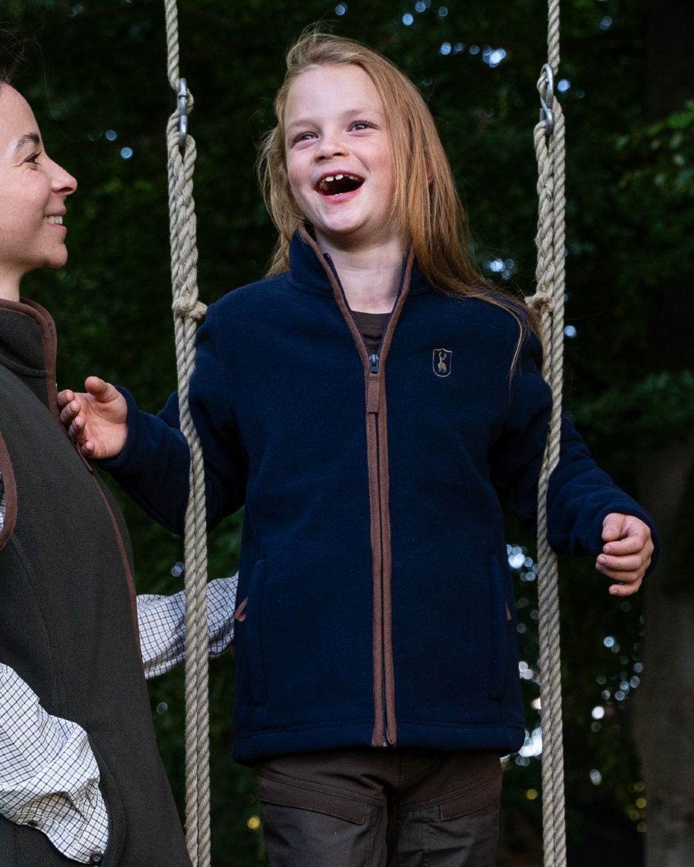 Dark Blue Coloured Deerhunter Youth Cumbria Fleece Jacket on forest background