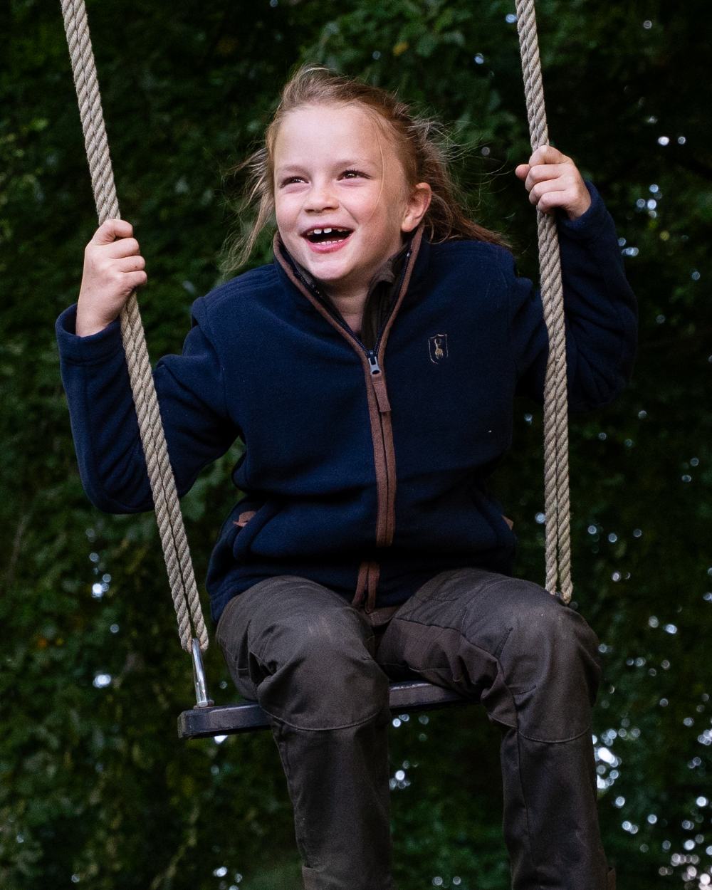Dark Blue Coloured Deerhunter Youth Cumbria Fleece Jacket on forest background