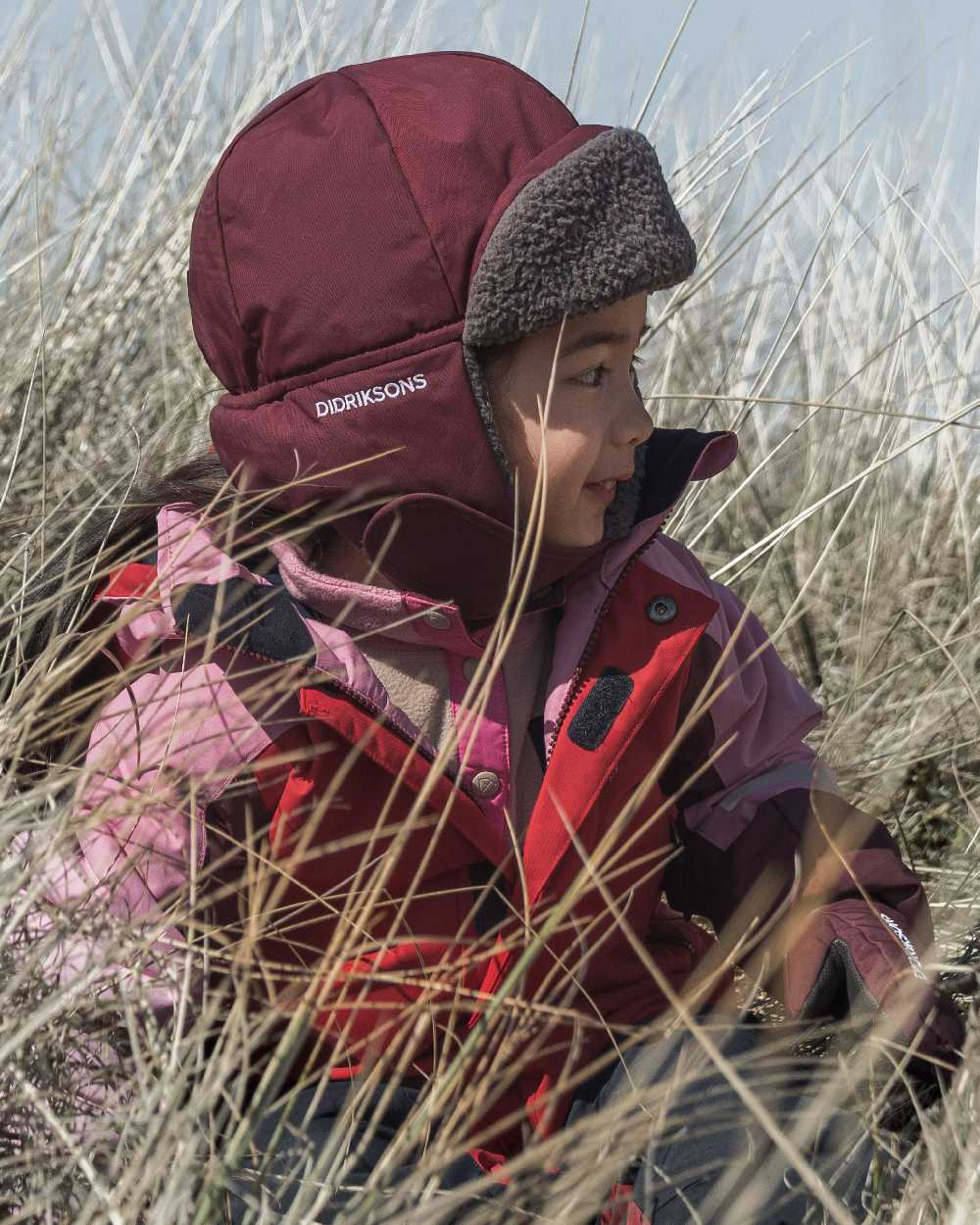 Anemon Red Coloured Didriksons Biggles Kids Cap on outdoor background