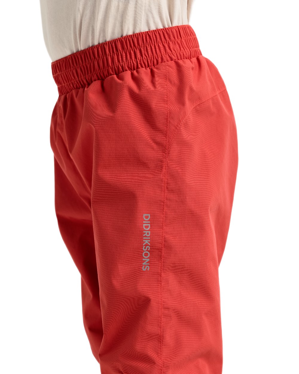 Paprika coloured Didriksons Childrens Avan Pants 2 on white background