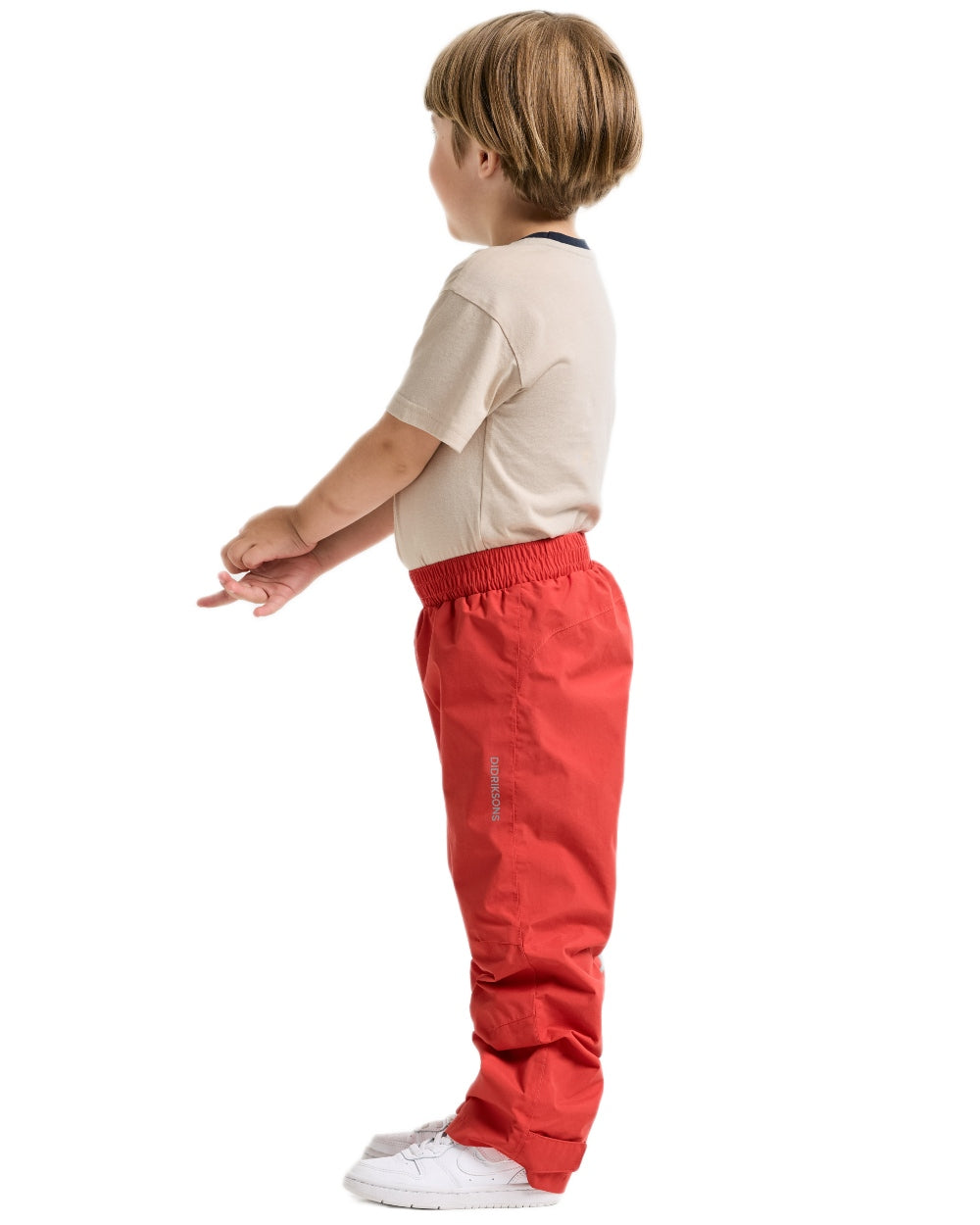 Paprika coloured Didriksons Childrens Avan Pants 2 on white background