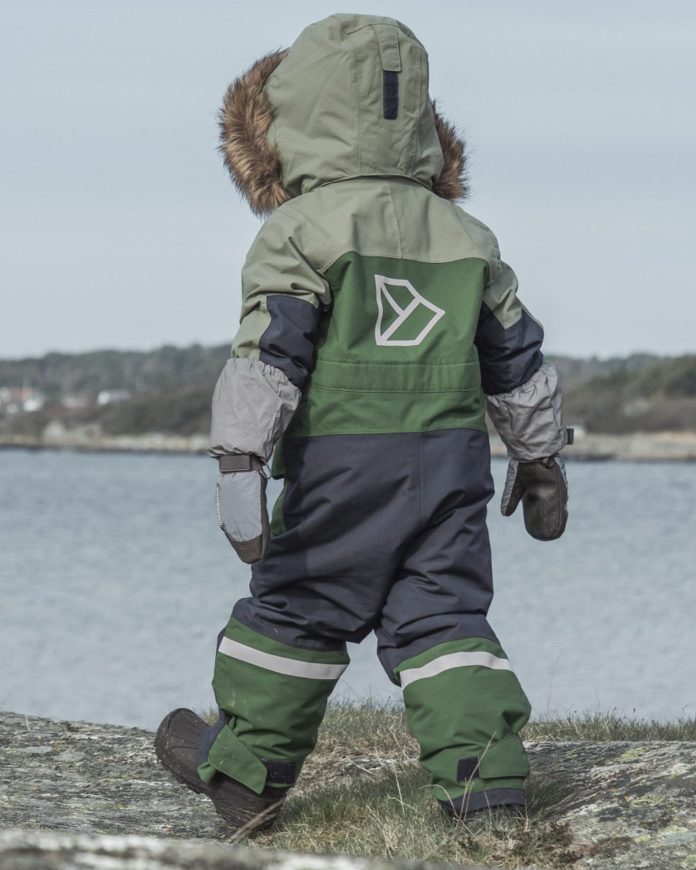 Silver coloured Didriksons Childrens Biggles Reflection Mittens on sea background