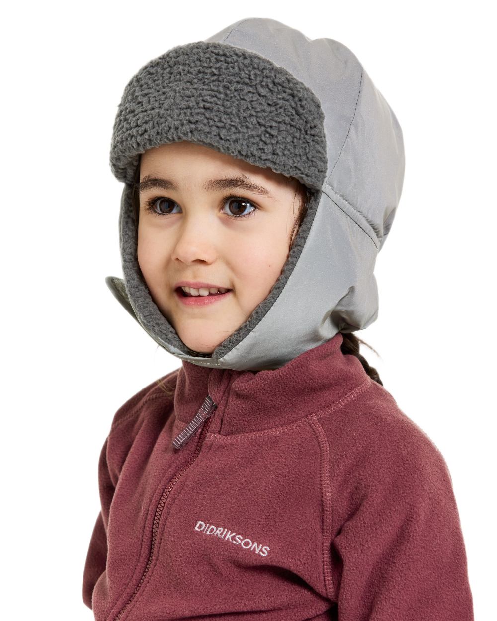 Silver coloured Didriksons Childrens Biggles Reflective Cap on white background