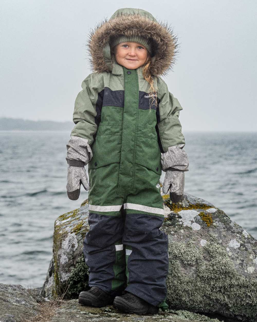 Light Moss Coloured Didriksons Childrens Bjärven Coveralls on outdoor background