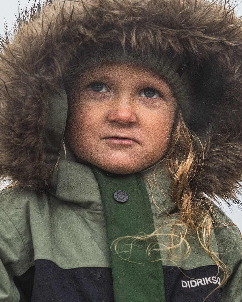 Light Moss Coloured Didriksons Childrens Bjärven Coveralls on outdoor background