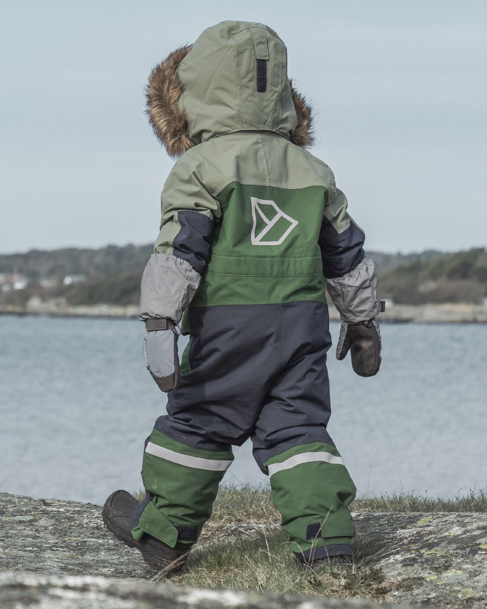 Light Moss Coloured Didriksons Childrens Bjärven Coveralls on outdoor background