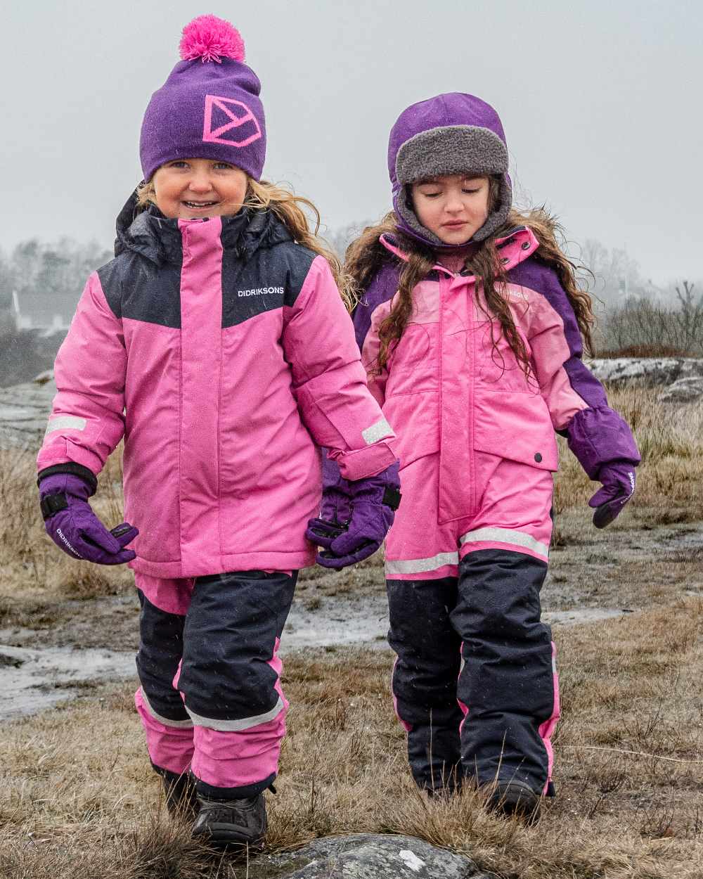 Sweet Pink Coloured Didriksons Childrens Bjärven Coveralls on outdoor background