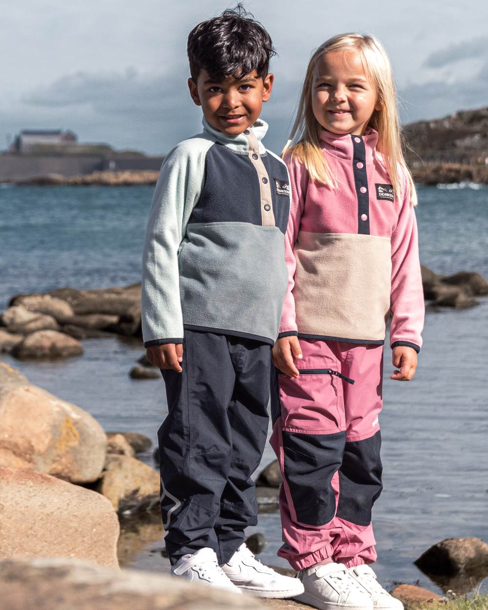 Factory Blue coloured Didriksons Childrens Monte Half Button Fleece 5 on sea background