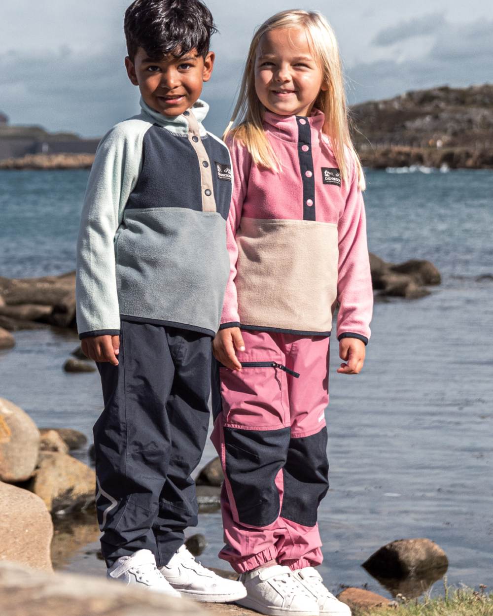 Heather Pink coloured Didriksons Childrens Monte Half Button Fleece 5 on sea background