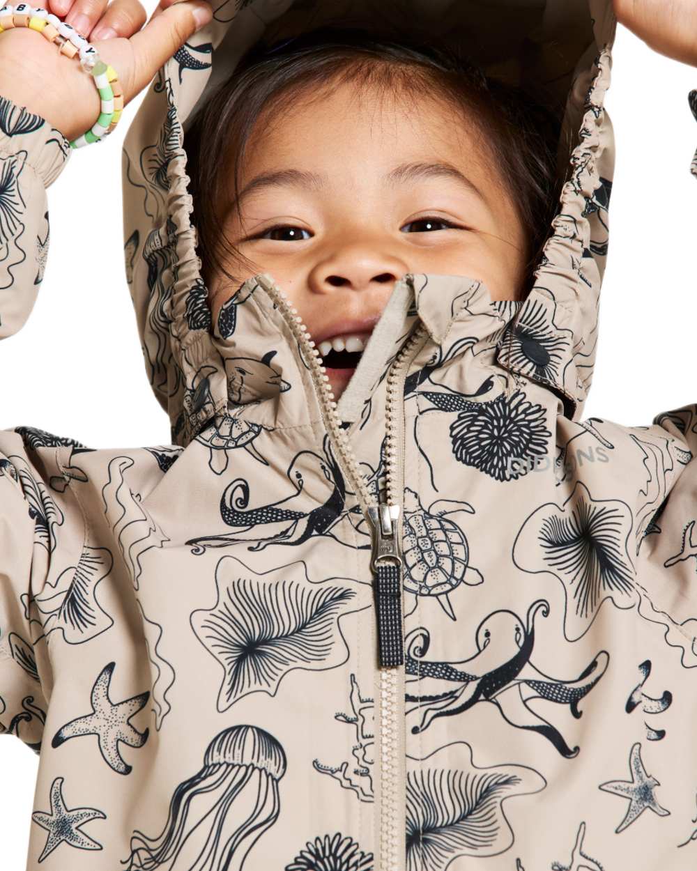 Ocean Beach Beige coloured Didriksons Childrens Norma Printed Jacket on white background