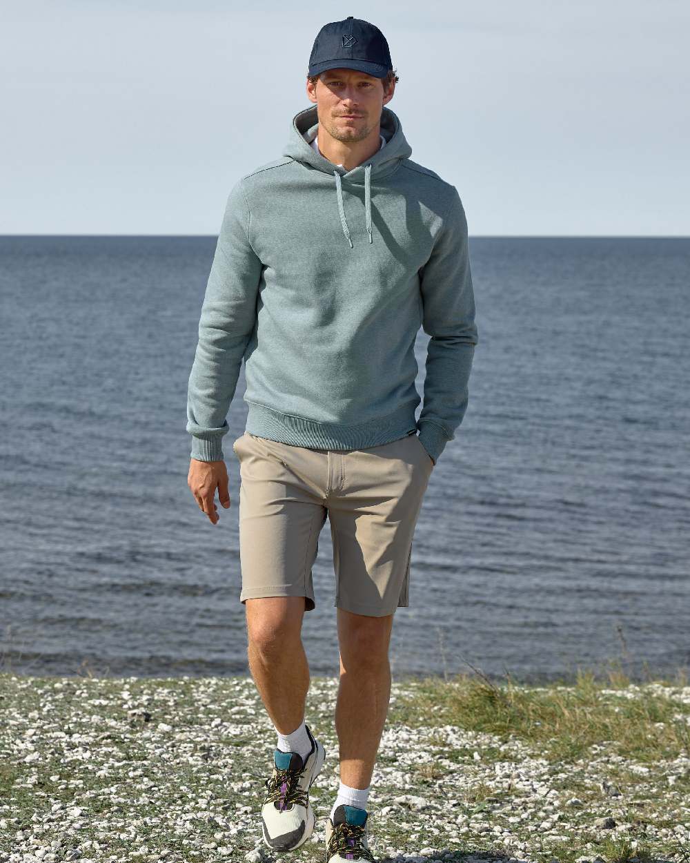 Ash Brown coloured Didriksons Mens Ian Shorts on sea background