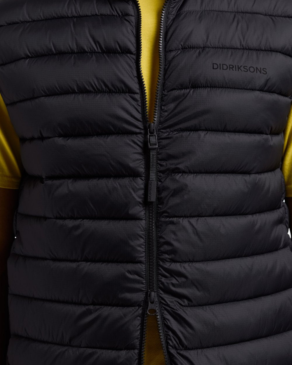 Black coloured Didriksons Mens Marino Vest on white background