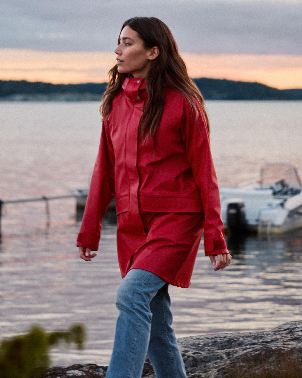 Spring Red Coloured Didriksons Womens Elly Galon Parka on outdoor background