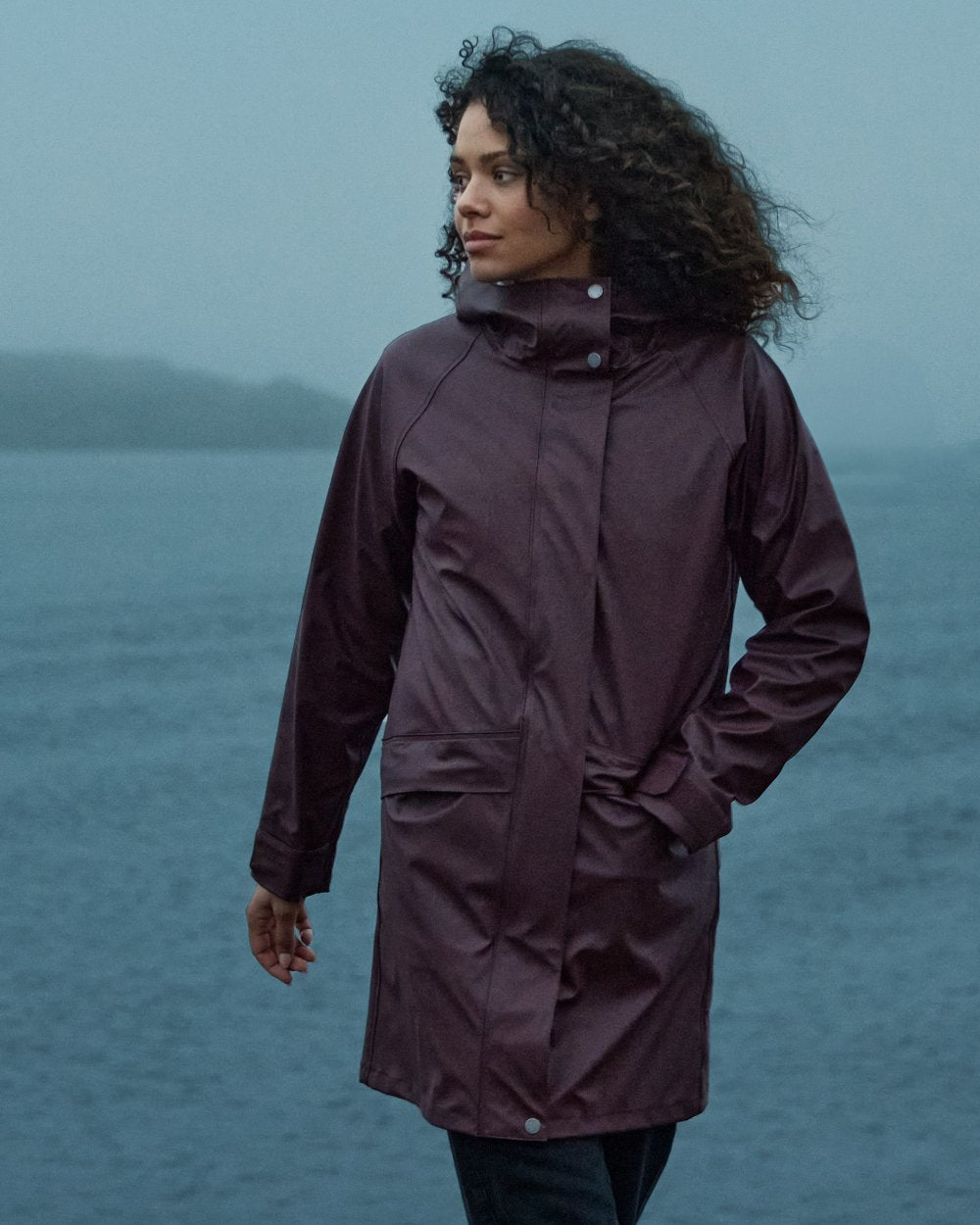 Old Rust coloured Didriksons Womens Elly Parka 4 on sea background