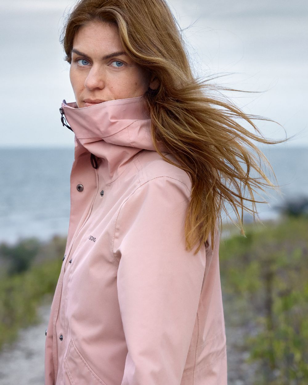 Oyster Lilac coloured Didriksons Womens Silja Jacket on blurry background