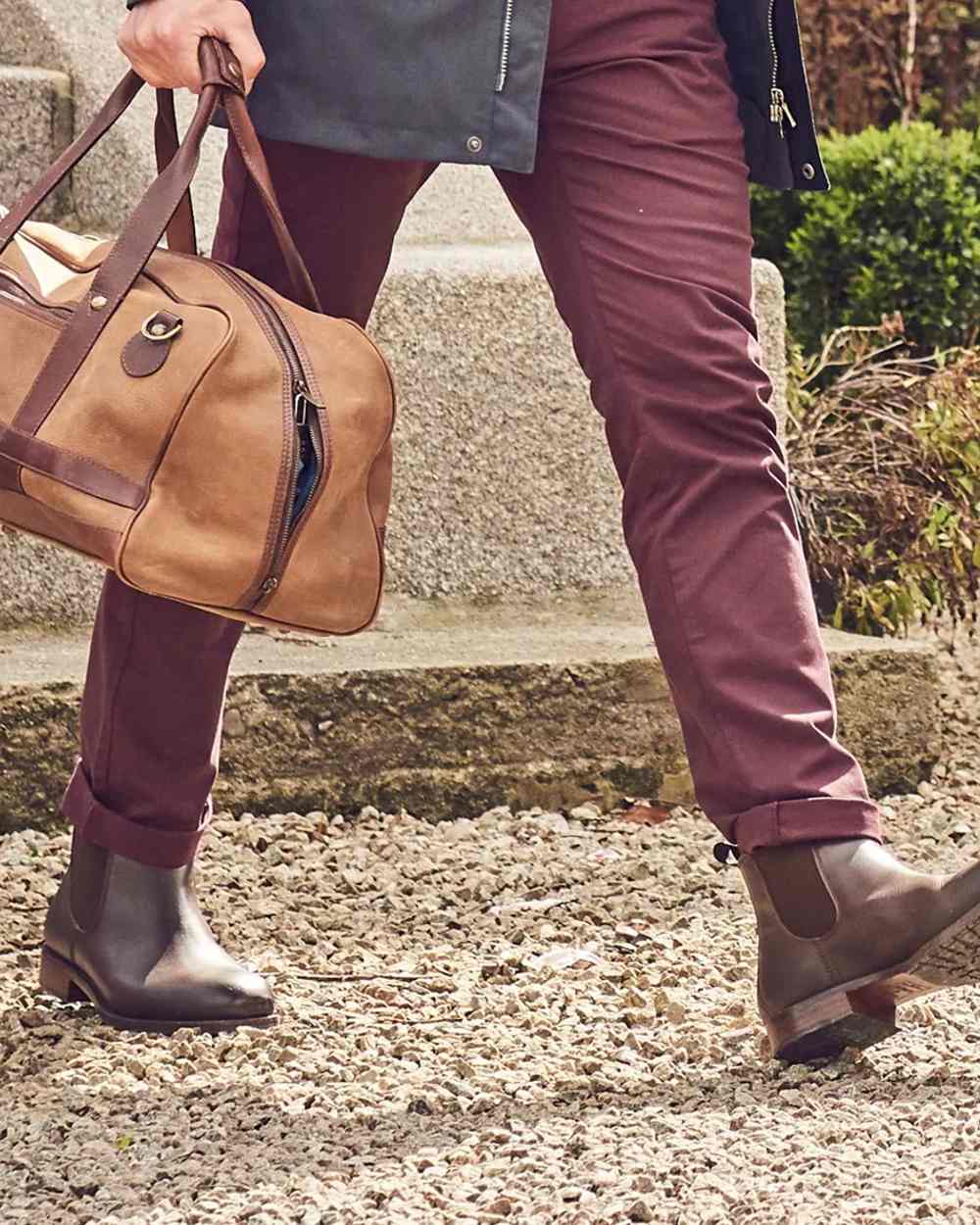 Mahogany coloured Dubarry Antrim Country Boots on stone background