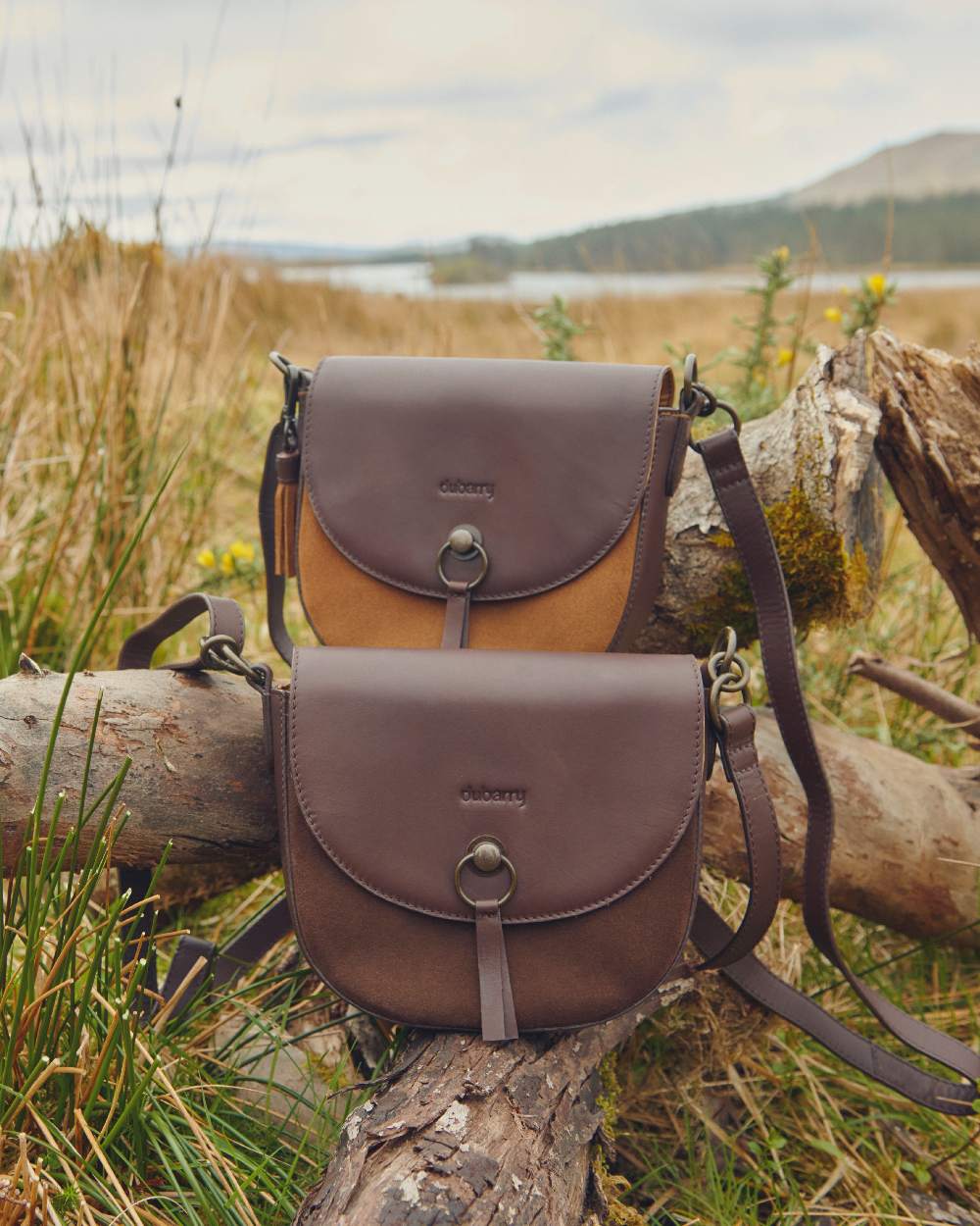 Camel coloured Dubarry Crossgar Saddle Bag on grassy background