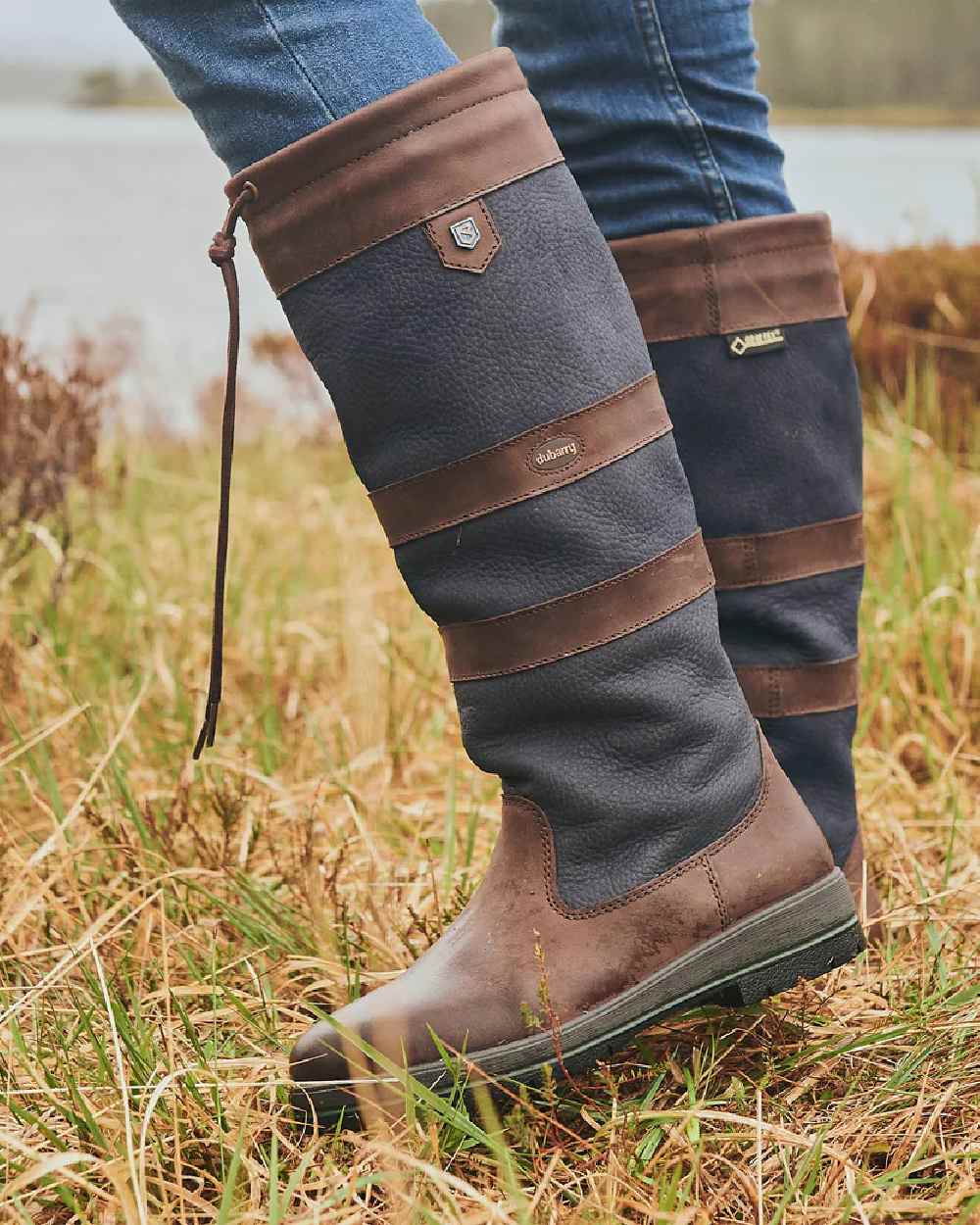 Navy Brown coloured Dubarry Galway Country Boots on grass background