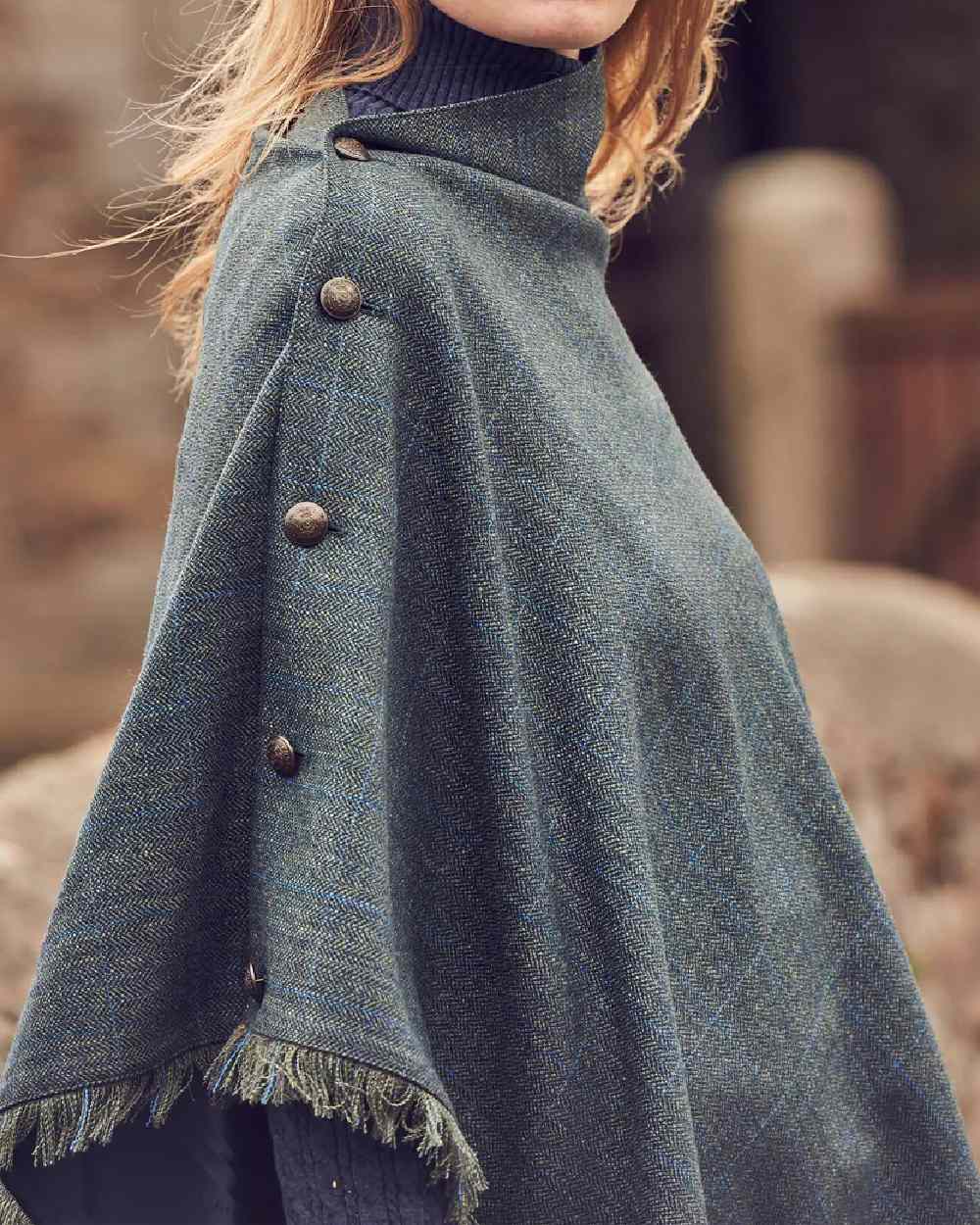 Mist Coloured Dubarry Hazelwood Tweed Poncho on blurry background