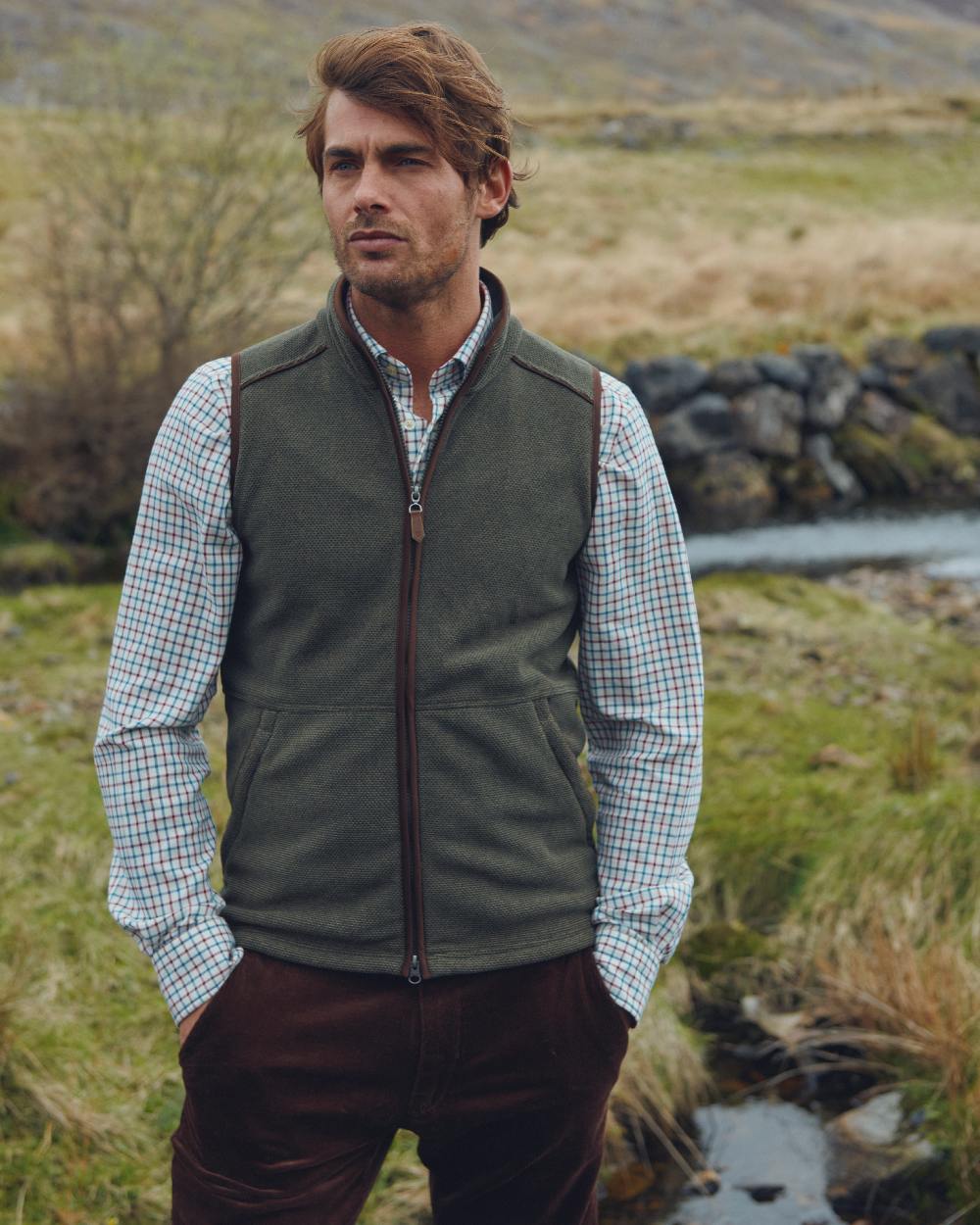 Olive Coloured Dubarry Mens Lifford Fleece Gilet on land background