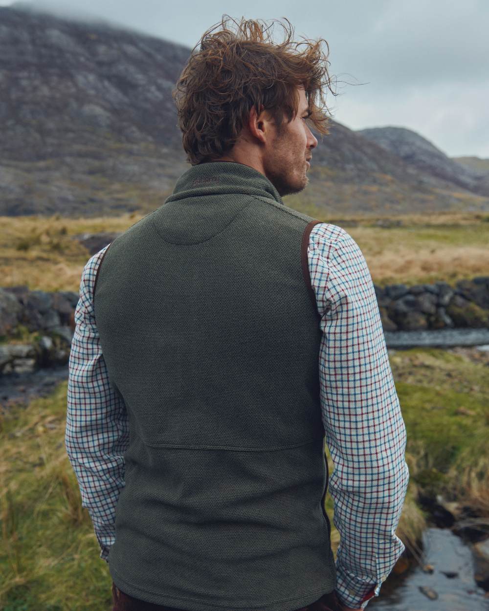 Olive Coloured Dubarry Mens Lifford Fleece Gilet on mountain background