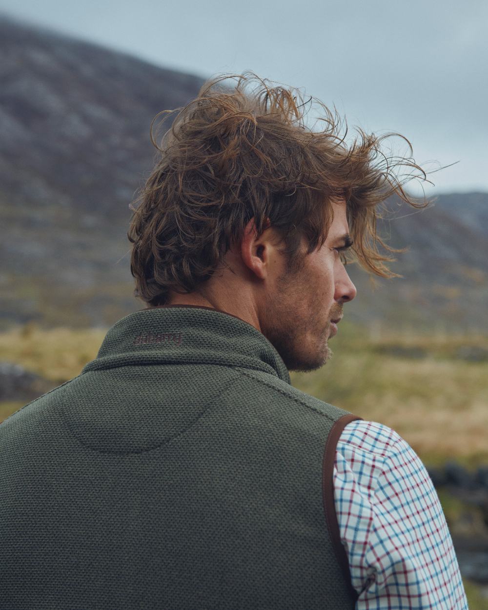 Olive Coloured Dubarry Mens Lifford Fleece Gilet on mountain background