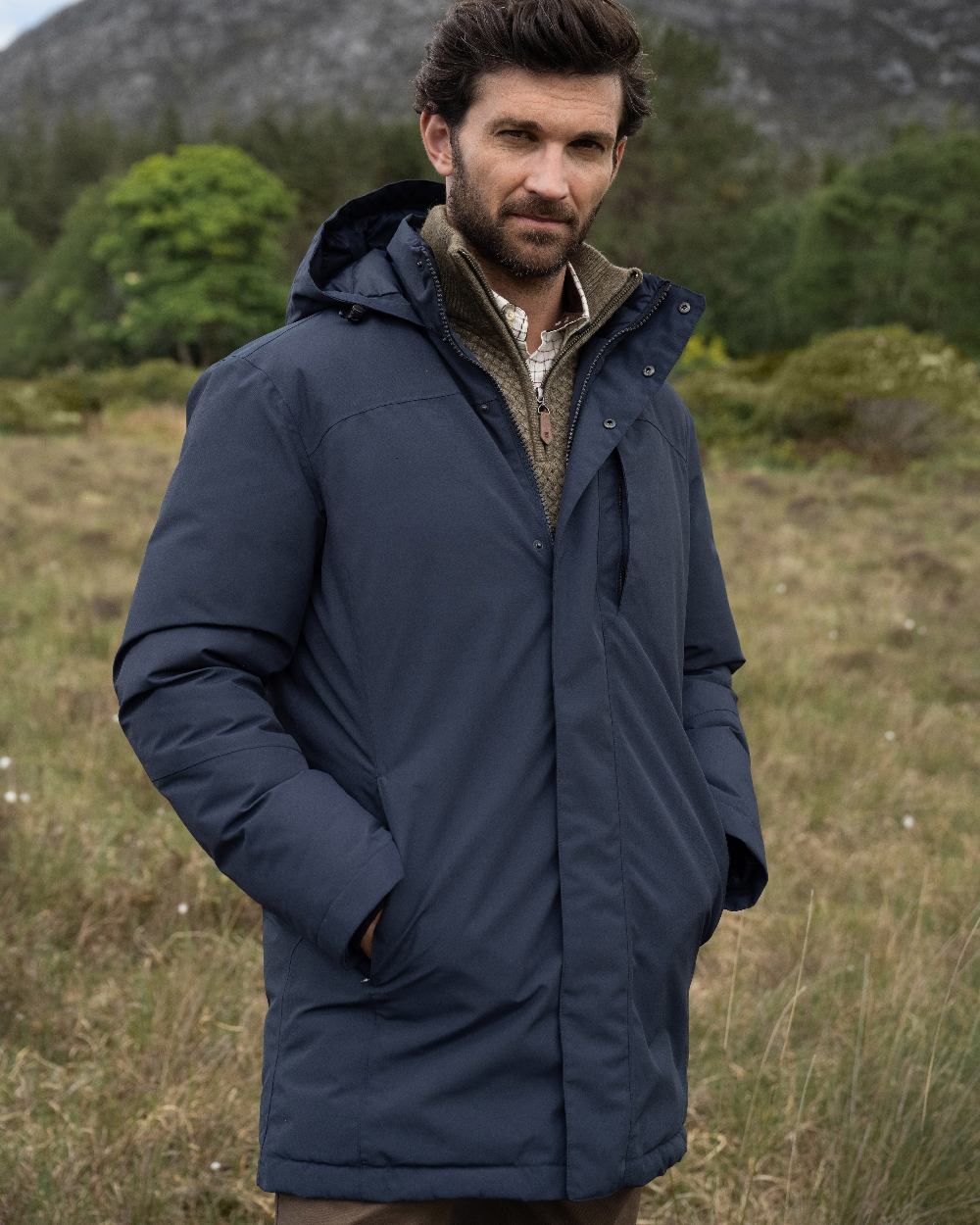 Navy Coloured Dubarry Mens Swiftsheath Waterproof Hooded Down Parka on outdoor background