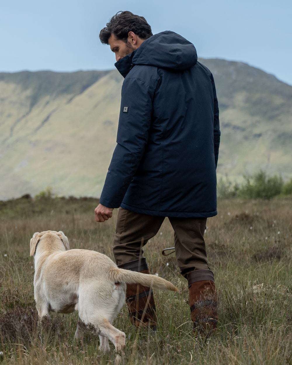 Navy Coloured Dubarry Mens Swiftsheath Waterproof Hooded Down Parka on outdoor background