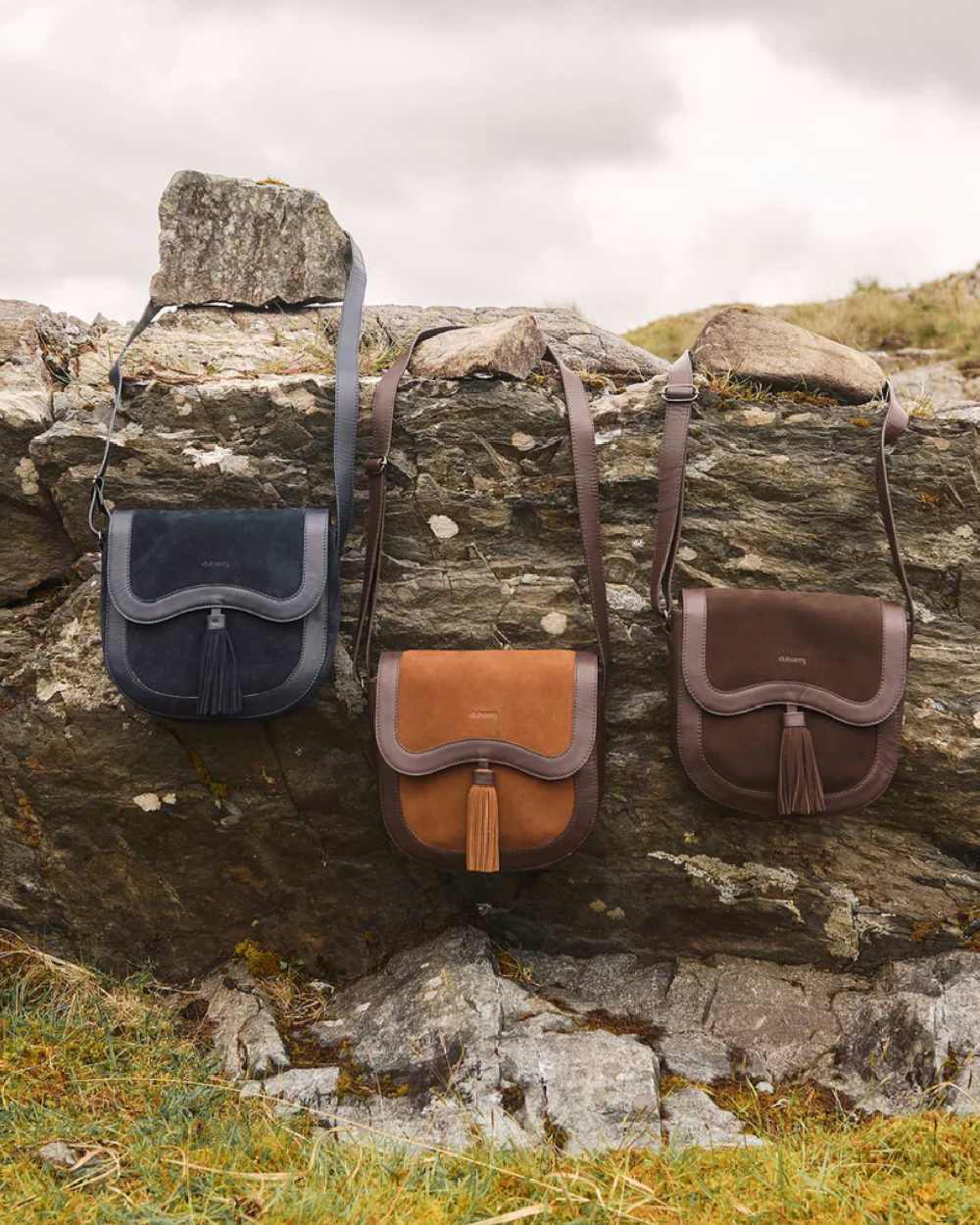 Camel coloured Dubarry Monart Saddle Bag on rock background