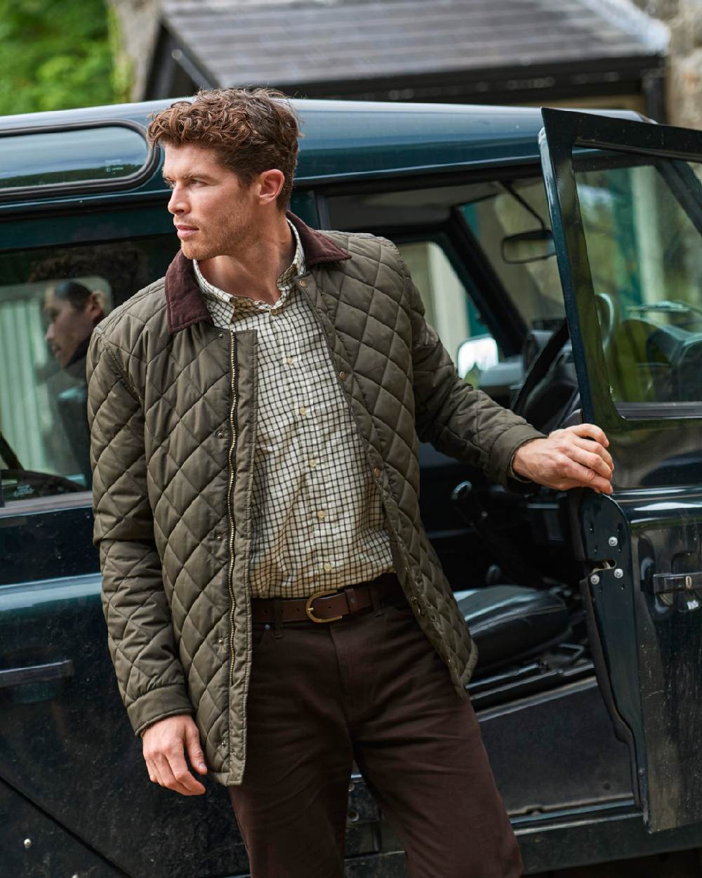 Olive coloured Dubarry Mountusher Quilted Jacket on car background