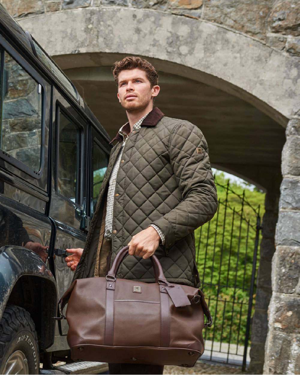 Olive coloured Dubarry Mountusher Quilted Jacket on car background