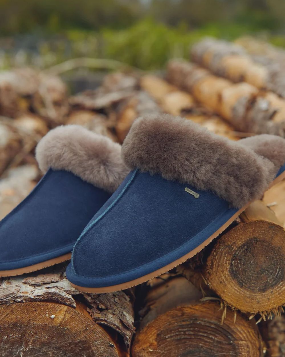 French Navy Coloured Dubarry Rockmill Slip On Slippers On A Wood Background