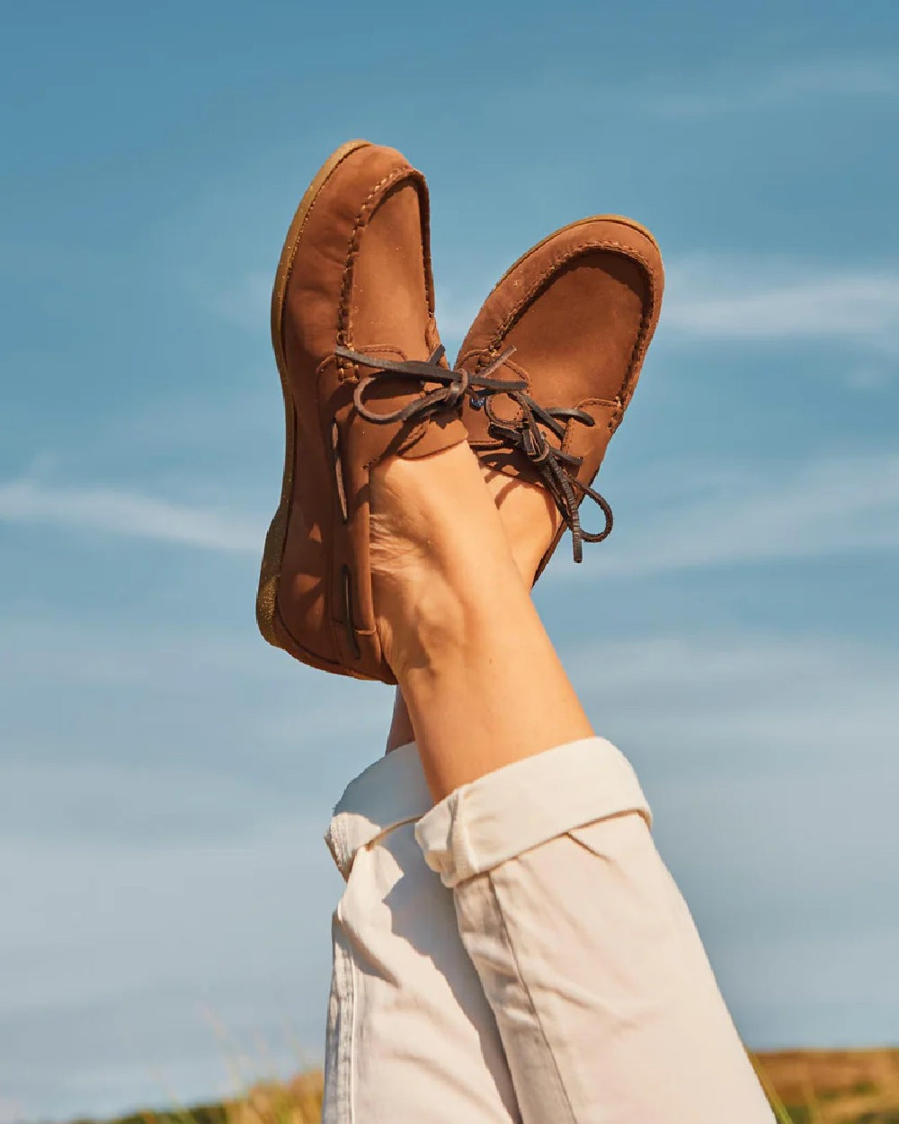 Cafe coloured Dubarry Womens Aruba Deck Shoes on sky background