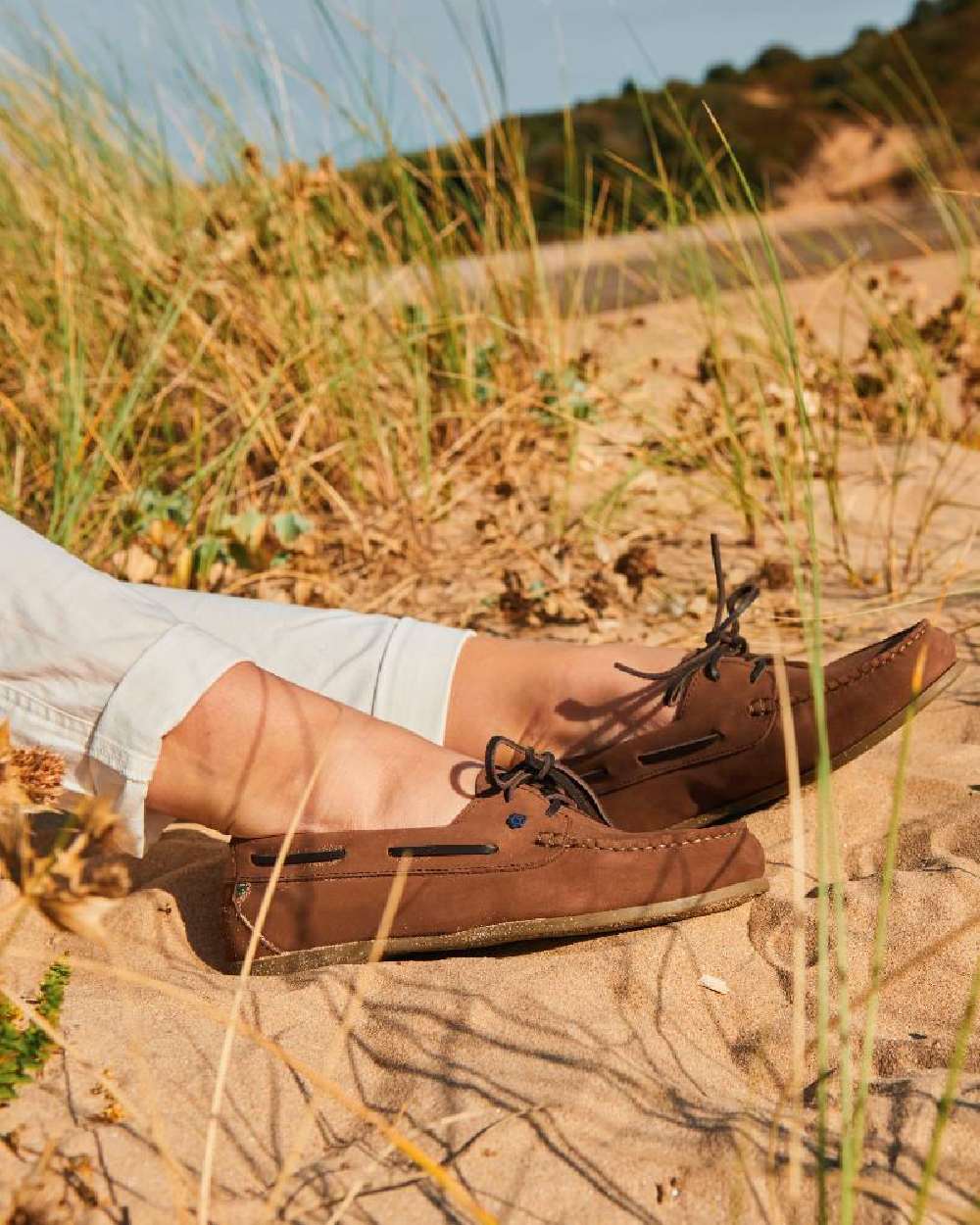 Cafe coloured Dubarry Womens Aruba Deck Shoes on forest background