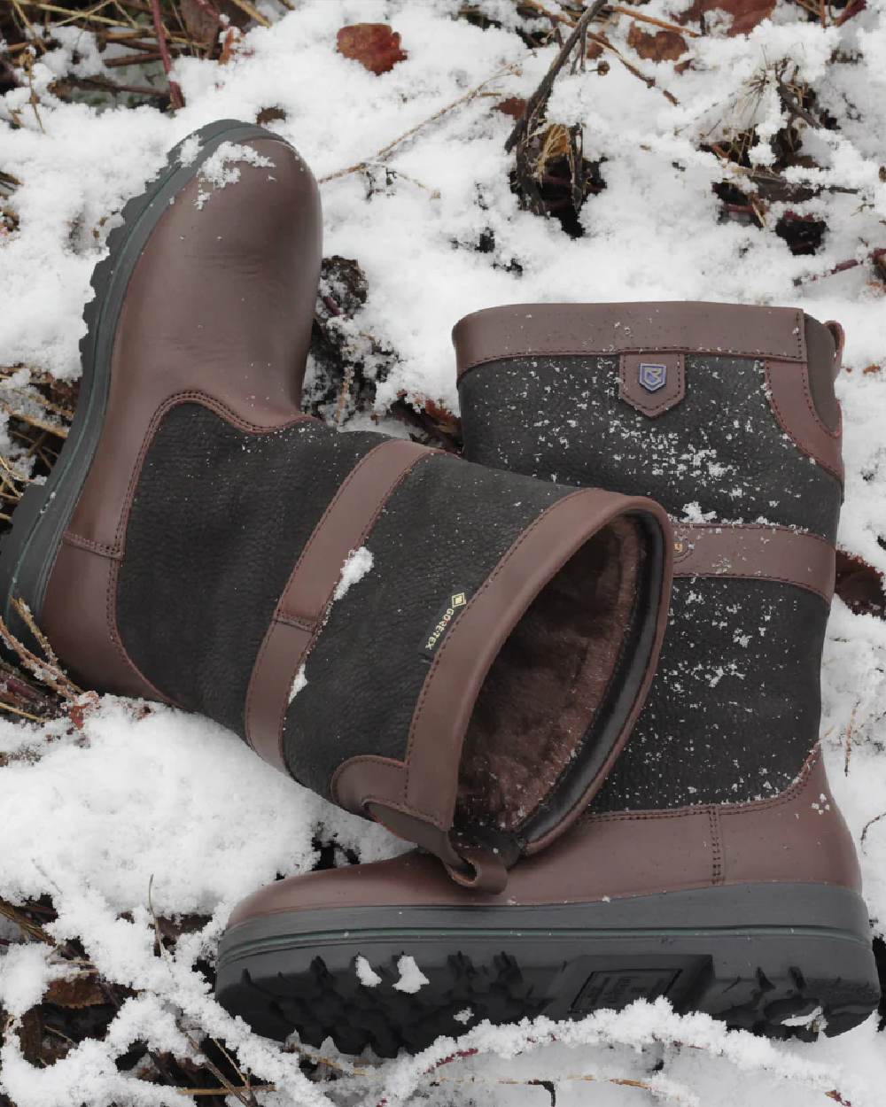 Black Brown Coloured Dubarry Womens Donegal Country Boots on snow background