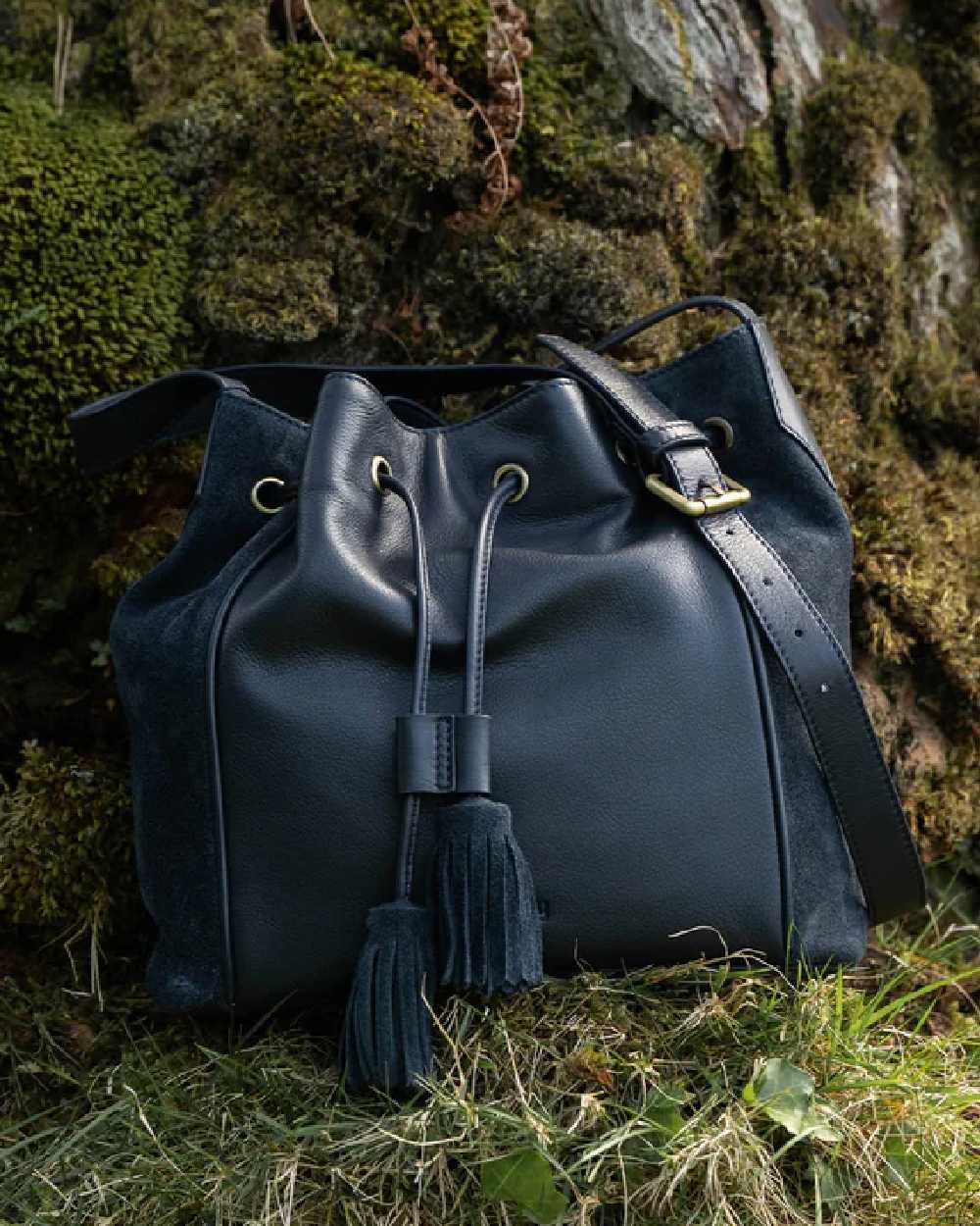 Navy Coloured Dubarry Womens Doonbeg Cross Body Bucket Bag on outdoor background