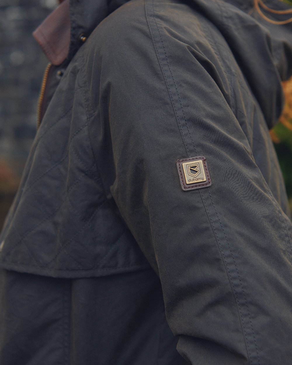 Verdigris Coloured Dubarry Womens Radford Wax Jacket on blurry background