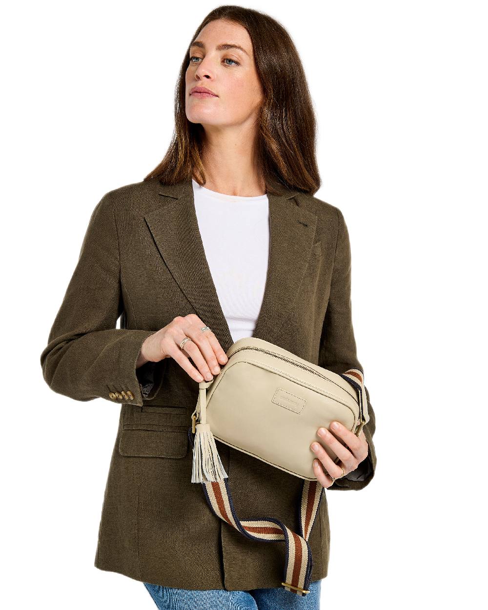 Oyster Coloured Dubarry Womens Rostrevor Cross Body Bag on outdoor background