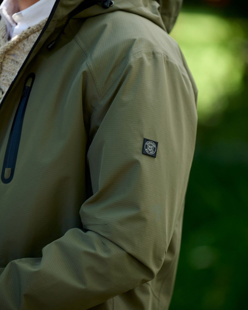 Kelp coloured Dubarry Mens Crossbarry Waterproof Jacket on outdoor background