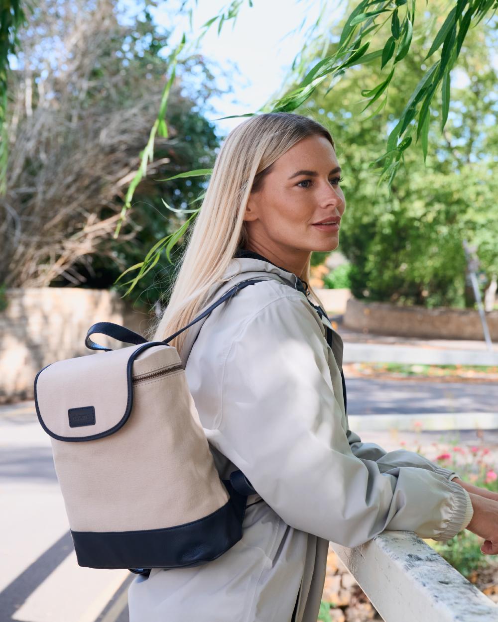 Navy coloured Dubarry Womens Rosegreen Canvas Backpack on park background
