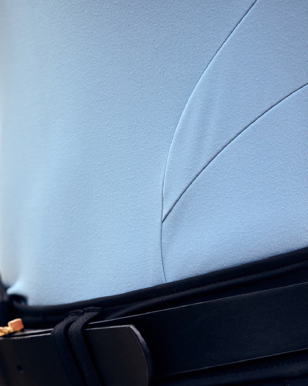 Blue Fog coloured Dublin Breathable Long Sleeve Riding Top on blurry background